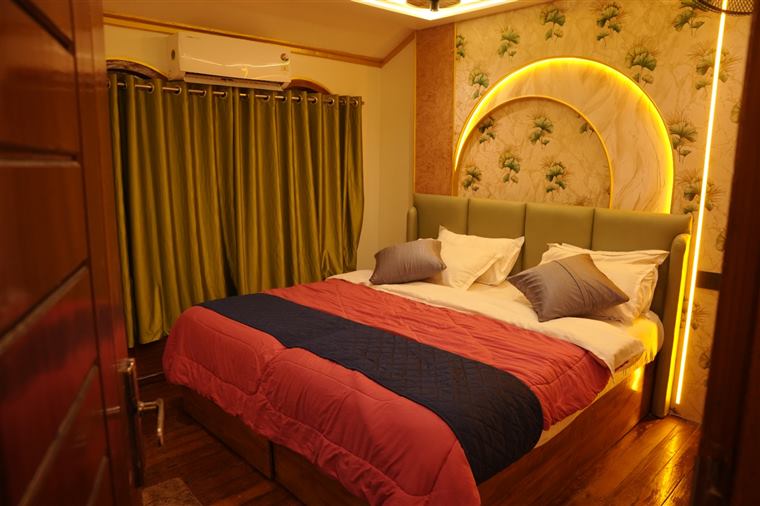 Honeymoon houseboat bedroom with soft lighting