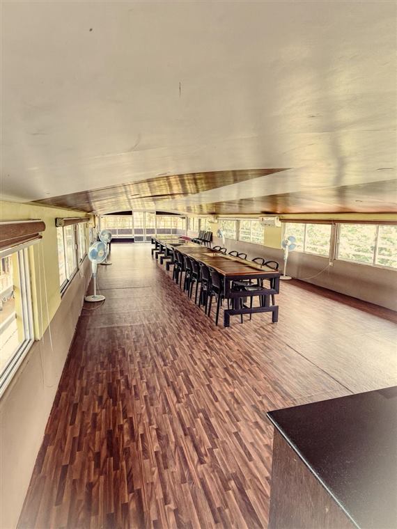 Long dining hall on a group houseboat